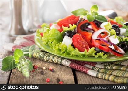 Vegetarian vegetable salad on a wooden table