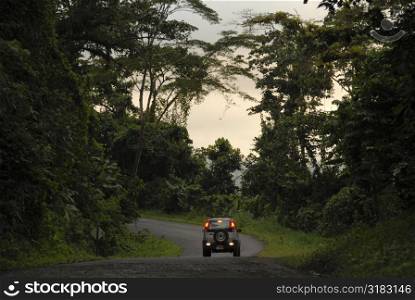 Vehicle driving down road in Costa Rica