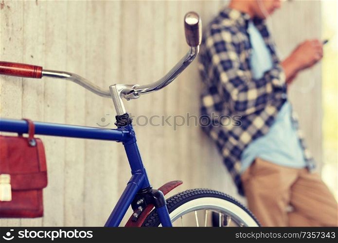 vehicle, people and lifestyle - man with fixed gear bicycle on street. man with fixed gear bicycle on street