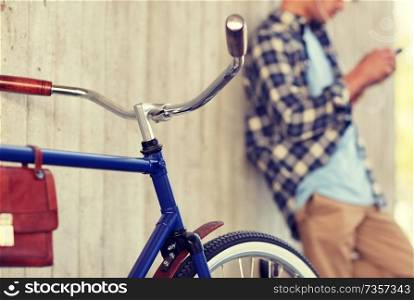 vehicle, people and lifestyle - man with fixed gear bicycle on street. man with fixed gear bicycle on street