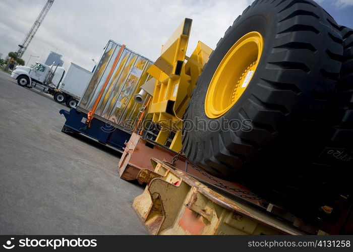 Vehicle tires and cargo containers at the shipping port