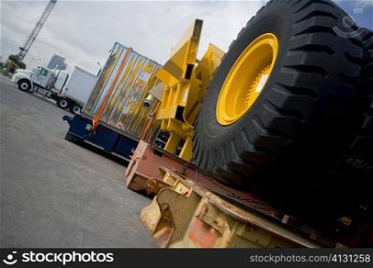 Vehicle tires and cargo containers at the shipping port