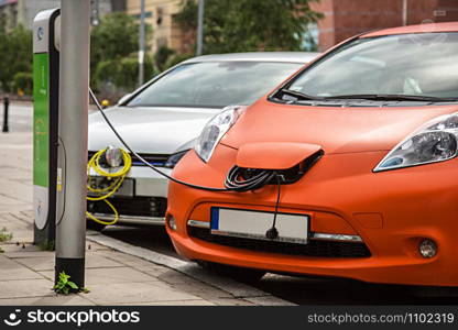 Vehicle with an electric motor. Eco car.. lettuce growing in the soil