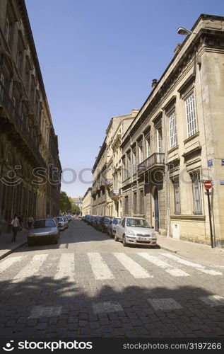 Vehicles parked on the both sides of a road, Rue Ferrere, Bordeaux, France