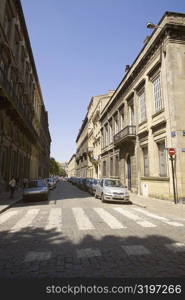 Vehicles parked on the both sides of a road, Rue Ferrere, Bordeaux, France