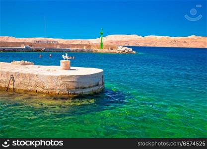 Velebit channel turquoise waterfront in Karlobag and desert island of Pag view, Croatia
