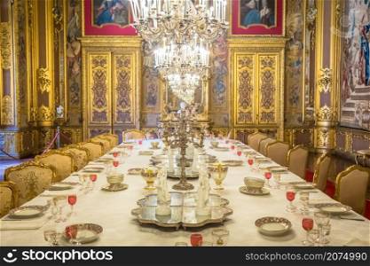 VENARIA REALE, ITALY - CIRCA AUGUST 2020: luxury dining room in Baroque style with gala dinner table setting
