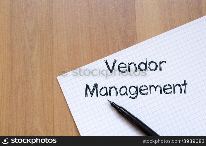 Vendor management text concept write on notebook with pen