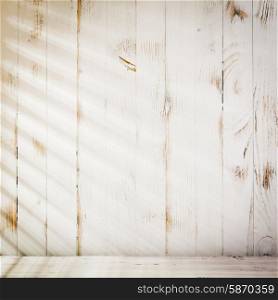 Venetian blinds sunlight on the shabby wooden wall