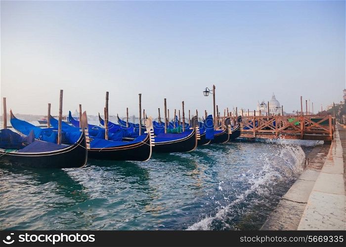 Venetian gondolas at sunrise in venice, Italy&#xA;