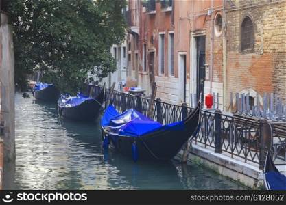 Venetian gondolas in narrow channel, Venice, Italy&#xA;