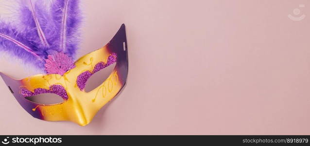 Venetian mask, Carnival mask for Mardi Gras celebration isolated on purple background banner design with copy space, jewish holiday, Purim in Hebrew holiday carnival ball, Happy Purim carnival concept