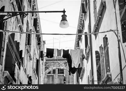 Venetian street with drying clothes, Venice, Italy  