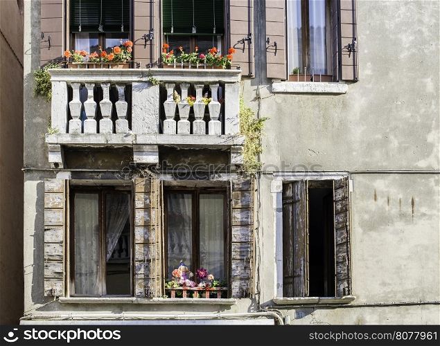 Venetian windows with flowers.