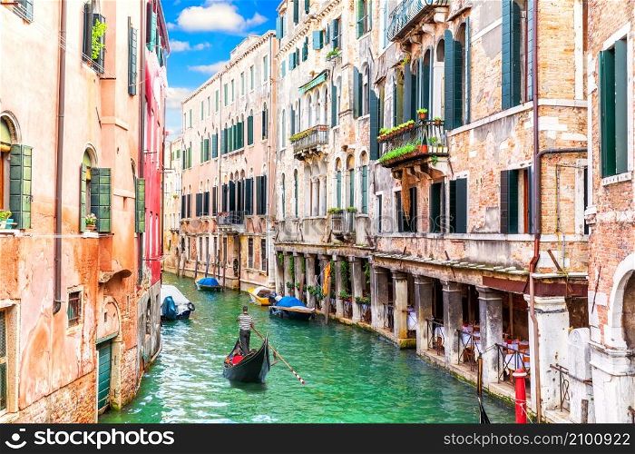 Venice canal and famous gondola, romantic view of Italy.