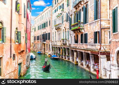 Venice canal and famous gondola, romantic view of Italy.