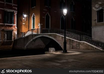Venice canal with gondolas at night. Italy. Empty Venice, No tourists