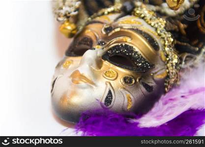 venice carnival mask and feathers on white background
