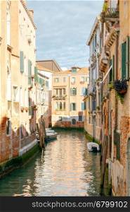 Venice. City Canal.. Traditional city canal in Venice and the facades of old buildings on the water.