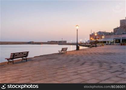 Venice embankment in the old harbor of Chania.. Old Venetian embankment and the bay at sunrise. Greece. Crete.