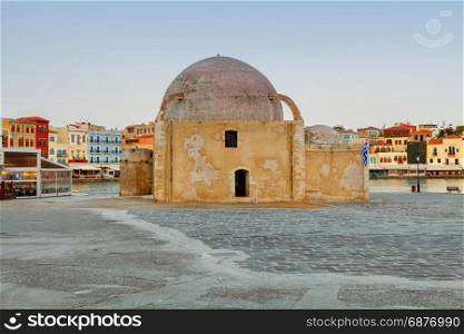 Venice embankment in the old harbor of Chania. Greece.. Embankment in the Venetian harbor and the old mosque. Chania. Crete.