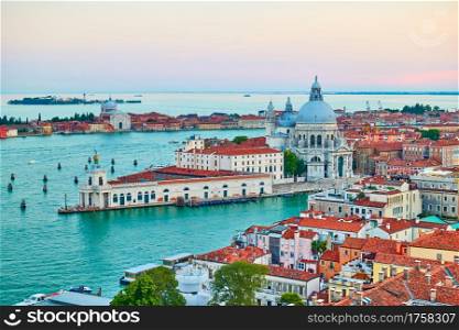 Venice in Italy. Panoramic view with The Grand Canal and Santa Maria della Salute church at dusk