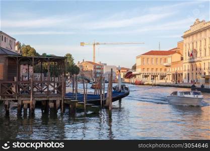 Venice is popular tourist destination of Europe. Beautiful view of Grand Canal with gondolas and colorful facades of old medieval buildings.. Grand Canal in Venice