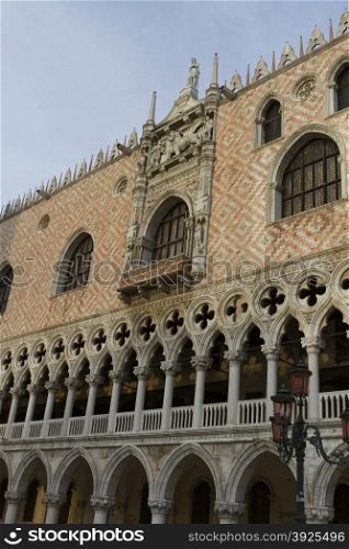 Venice, Italy - April 1, 2013: Street views of ancient architecture in Venice, Italy. Venice is a city in northeastern Italy sited on a group of 118 small islands separated by canals and linked by bridges.