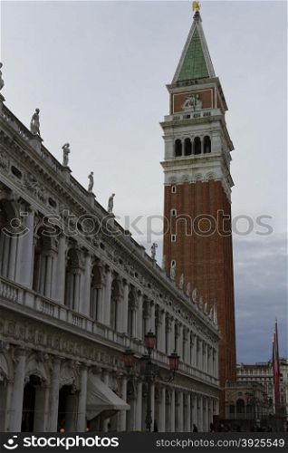 Venice, Italy - April 1, 2013: Street views of ancient architecture in Venice, Italy. Venice is a city in northeastern Italy sited on a group of 118 small islands separated by canals and linked by bridges.