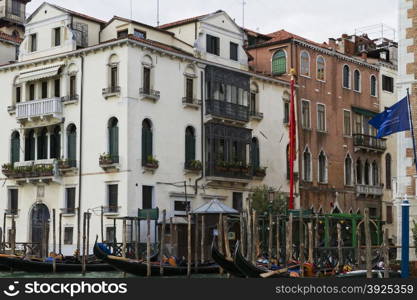 Venice, Italy - April 1, 2013: Street views of canals and ancient architecture in Venice, Italy. Venice is a city in northeastern Italy sited on a group of 118 small islands separated by canals and linked by bridges.