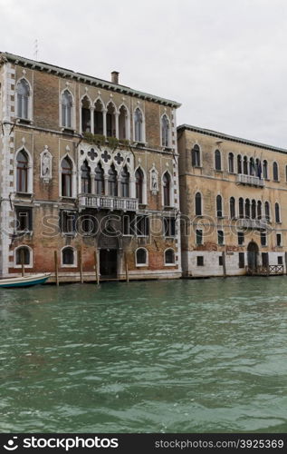 Venice, Italy - April 1, 2013: Street views of canals and ancient architecture in Venice, Italy. Venice is a city in northeastern Italy sited on a group of 118 small islands separated by canals and linked by bridges.