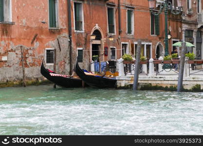 Venice, Italy - April 1, 2013: Street views of canals and ancient architecture in Venice, Italy. Venice is a city in northeastern Italy sited on a group of 118 small islands separated by canals and linked by bridges.