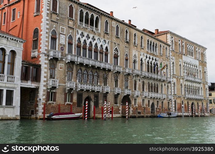 Venice, Italy - April 1, 2013: Street views of canals and ancient architecture in Venice, Italy. Venice is a city in northeastern Italy sited on a group of 118 small islands separated by canals and linked by bridges.