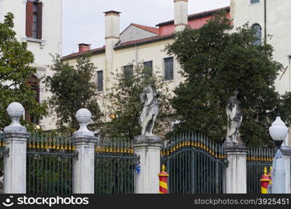 Venice, Italy - April 1, 2013: Street views of canals and ancient architecture in Venice, Italy. Venice is a city in northeastern Italy sited on a group of 118 small islands separated by canals and linked by bridges.