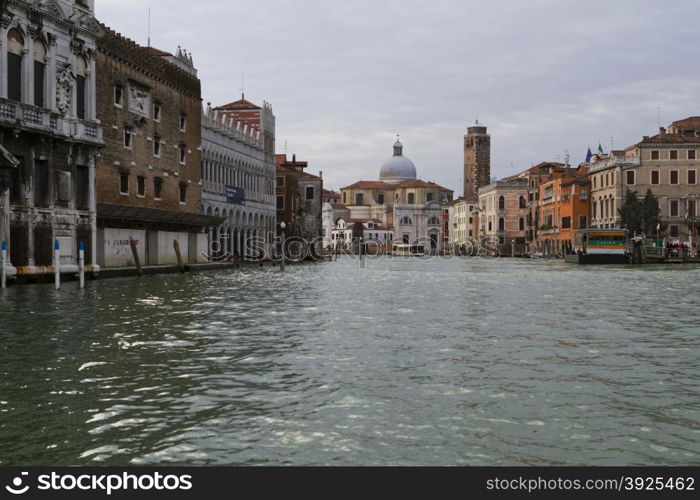 Venice, Italy - April 1, 2013: Street views of canals and ancient architecture in Venice, Italy. Venice is a city in northeastern Italy sited on a group of 118 small islands separated by canals and linked by bridges.