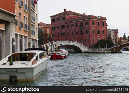 Venice, Italy - April 1, 2013: Street views of canals and ancient architecture in Venice, Italy. Venice is a city in northeastern Italy sited on a group of 118 small islands separated by canals and linked by bridges.