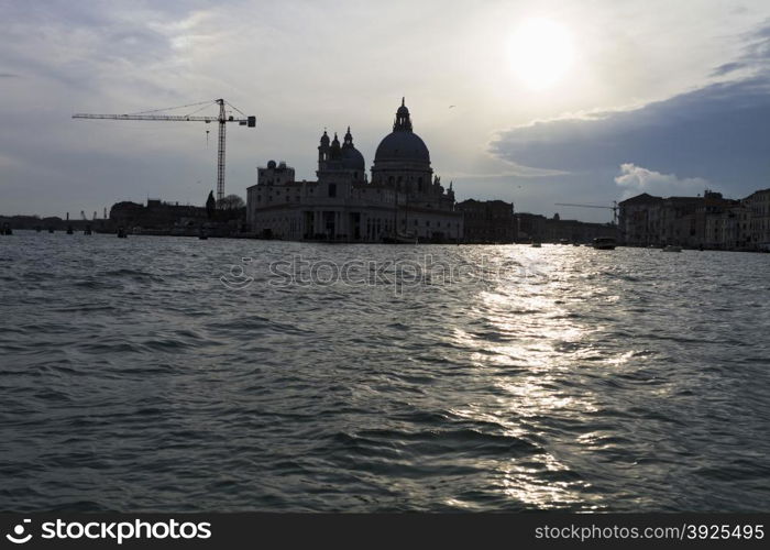 Venice, Italy - April 1, 2013: Street views of canals and ancient architecture in Venice, Italy. Venice is a city in northeastern Italy sited on a group of 118 small islands separated by canals and linked by bridges.