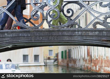 Venice, Italy - April 1, 2013: Street views of canals and ancient architecture in Venice, Italy. Venice is a city in northeastern Italy sited on a group of 118 small islands separated by canals and linked by bridges.