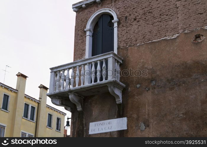 Venice, Italy - April 1, 2013: Street views of canals and ancient architecture in Venice, Italy. Venice is a city in northeastern Italy sited on a group of 118 small islands separated by canals and linked by bridges.