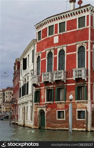 Venice, Italy - April 1, 2013: Street views of canals and ancient architecture in Venice, Italy. Venice is a city in northeastern Italy sited on a group of 118 small islands separated by canals and linked by bridges.