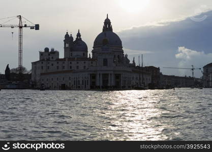 Venice, Italy - April 1, 2013: Street views of canals and ancient architecture in Venice, Italy. Venice is a city in northeastern Italy sited on a group of 118 small islands separated by canals and linked by bridges.