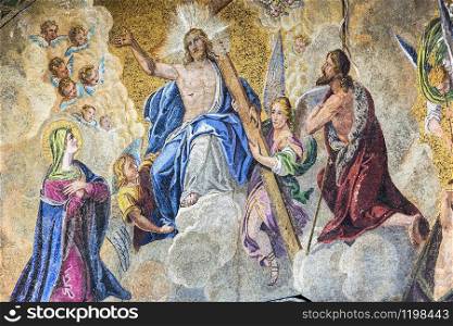 VENICE, ITALY - NOVEMBER 02, 2014: A fragment of an ancient mosaic located above the entrance to The Patriarchal Cathedral Basilica of Saint Mark in Venice. Italy.