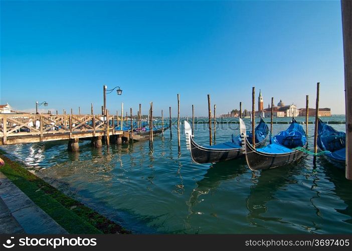 Venice Italy pittoresque view of gondolas with Saint George island on background