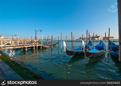 Venice Italy pittoresque view of gondolas with Saint George island on background