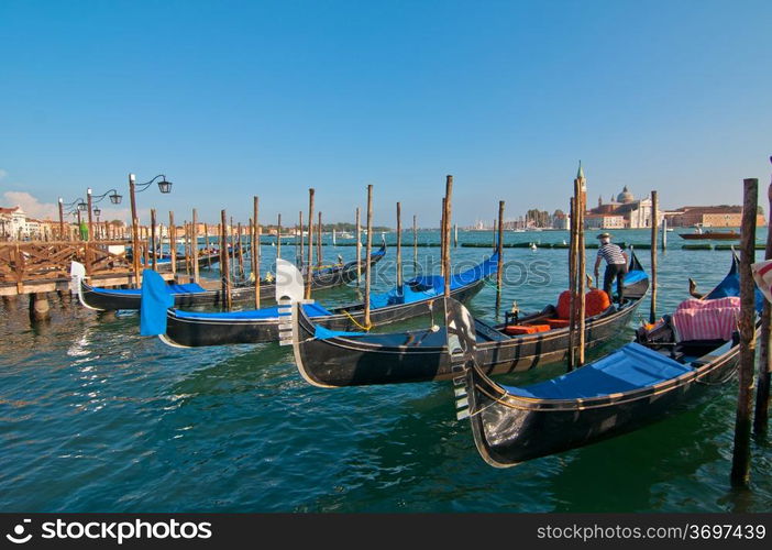 Venice Italy pittoresque view of gondolas with Saint George island on background