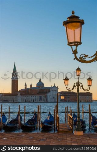 Venice Italy seafront with gondolas at sunrise