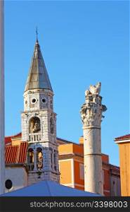 Venice lion on top of the column and church steeple in Zadar