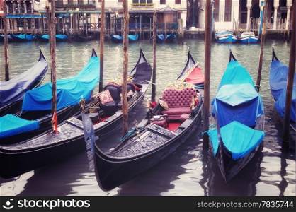 Venice seafront with gondolas on the waves. Venice, Italy