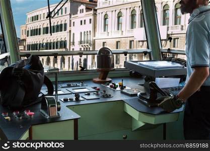 Venice Urban Steamboat Driver in Cabin, Italy