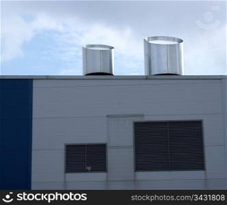Ventilation on a roof and a wall of an industrial building